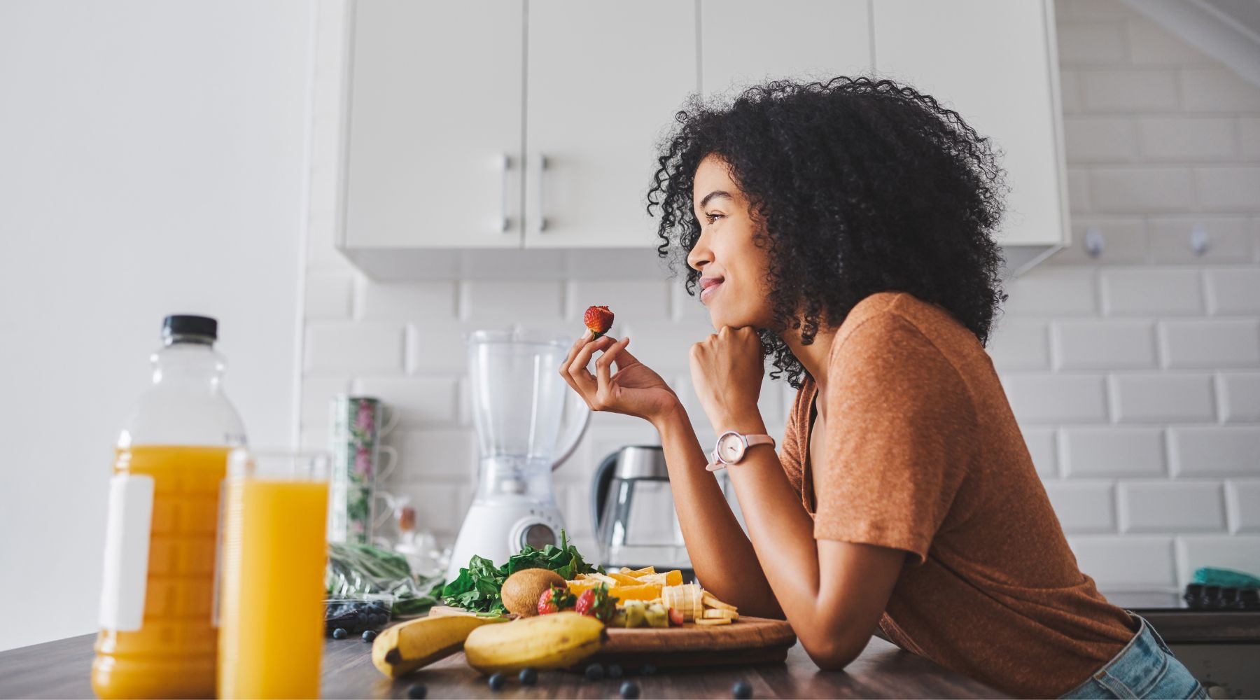 Woman enjoying a healthy breakfast rich in vitamin C