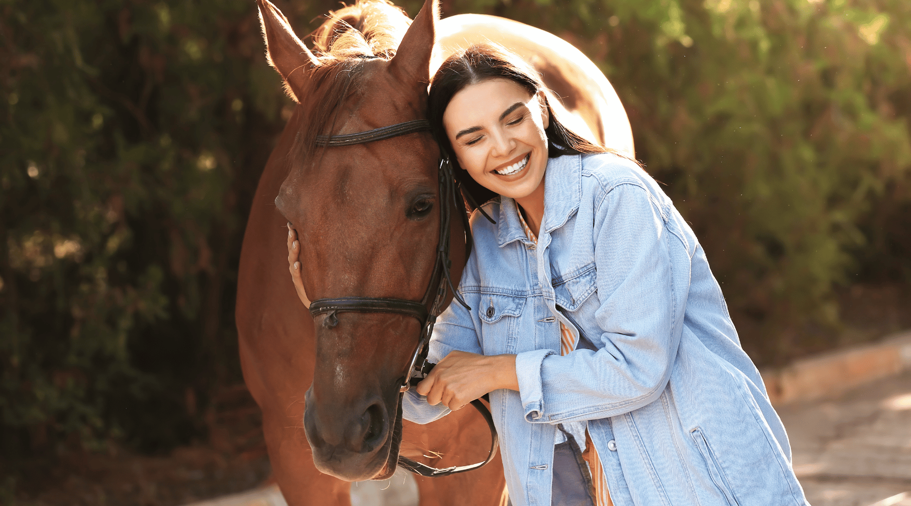 Close-up image of a woman hugging her horse