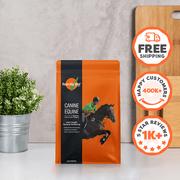 Orange package labeled 'Canine Equine' with promotional stickers on a neutral background